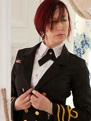 Redhead Anilos stewardess flaunts her big jugs in a bra
